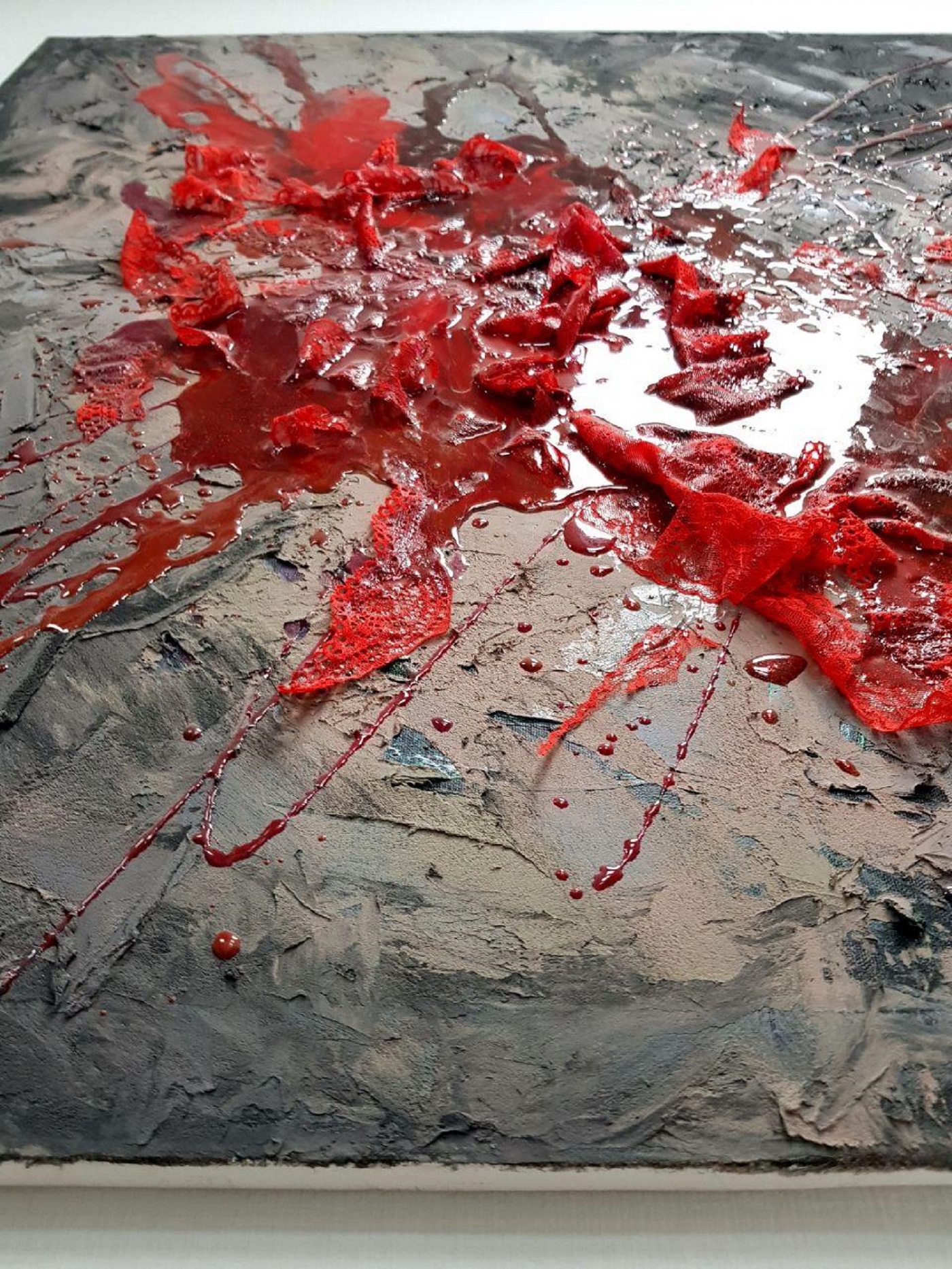 Puddle of blood on the asphalt