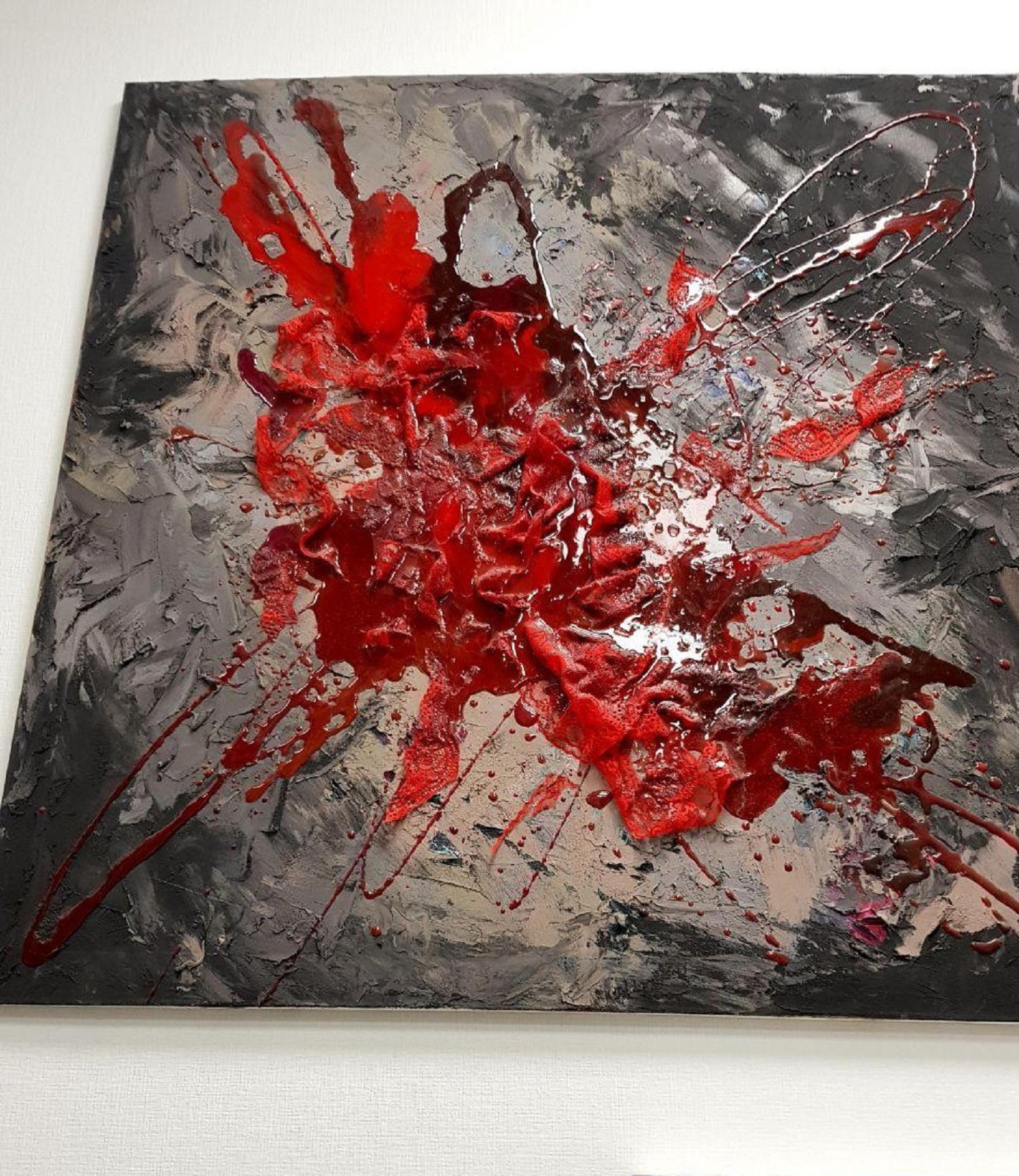 Puddle of blood on the asphalt